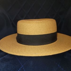 Brand new with tags, never worn, tan with black fabric strip, summer hat.